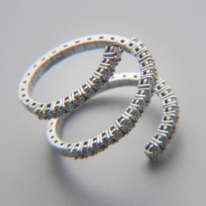 Anello spirale in oro bianco e diamanti